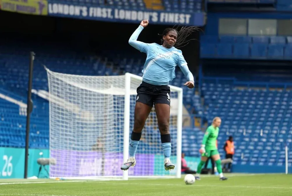 Khadija Shaw celebrates after scoring for Manchester City