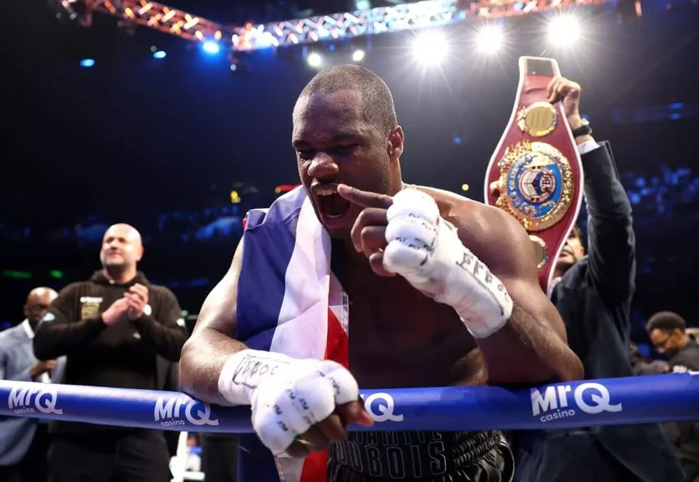 Daniel Dubois holds up his left index finger while yelling to the crowd after his win over Fabio Wardley in Manchester, England.