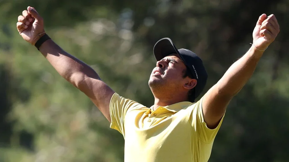 South Africa's Yurav Premlall holds his arms aloft in celebration